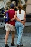 photo of a North American couple walking together very close