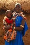 photo of a Masai woman holding her young child
