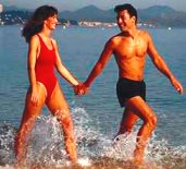 photo of a young man and woman at the beach