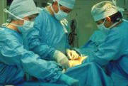 Photo of Western trained surgeons operating on a patient