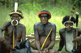 Photo of three contemporary tribal men in Papua New Guinea dressed for a ceremonial occasion