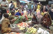 Photo of a crowded small town market place in Papua New Guinea