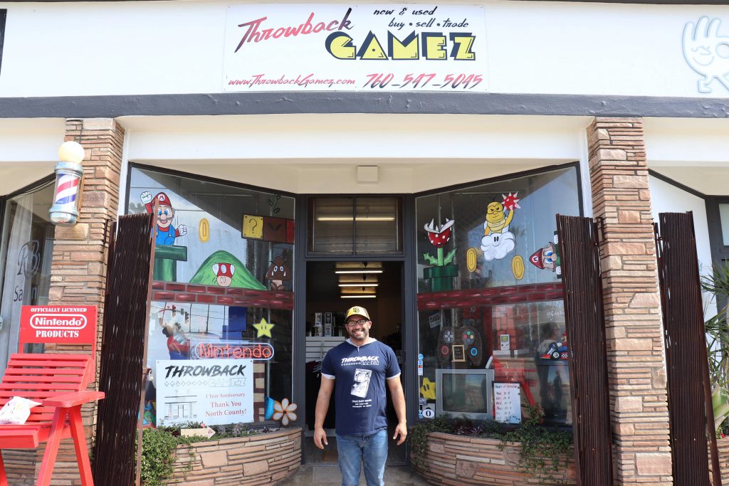 Owner Manny Mimoso beams in front of Throwback Gamez, which had undergone major repairs in the early days of the COVID-19 pandemic after he signed the lease one day before the California shutdown on March 11, 2020. (Max Cruz/IMPACT Magazine)